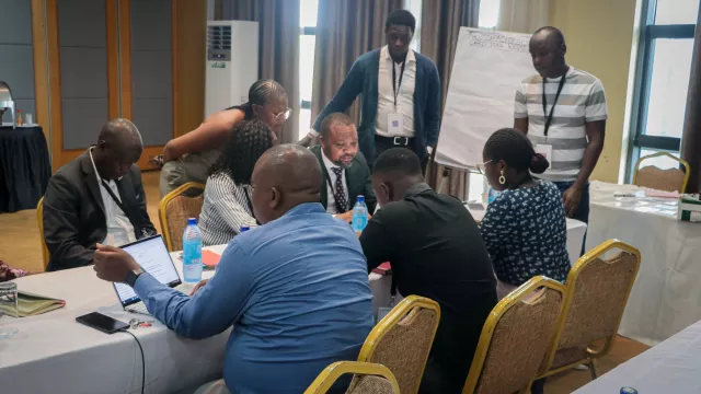 Participants engaging with the scorecard in a breakout session. 