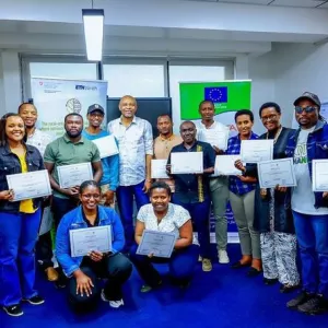 Dr Okike Iheanacho and trainees holding their certificates after the FeedCalculator training.